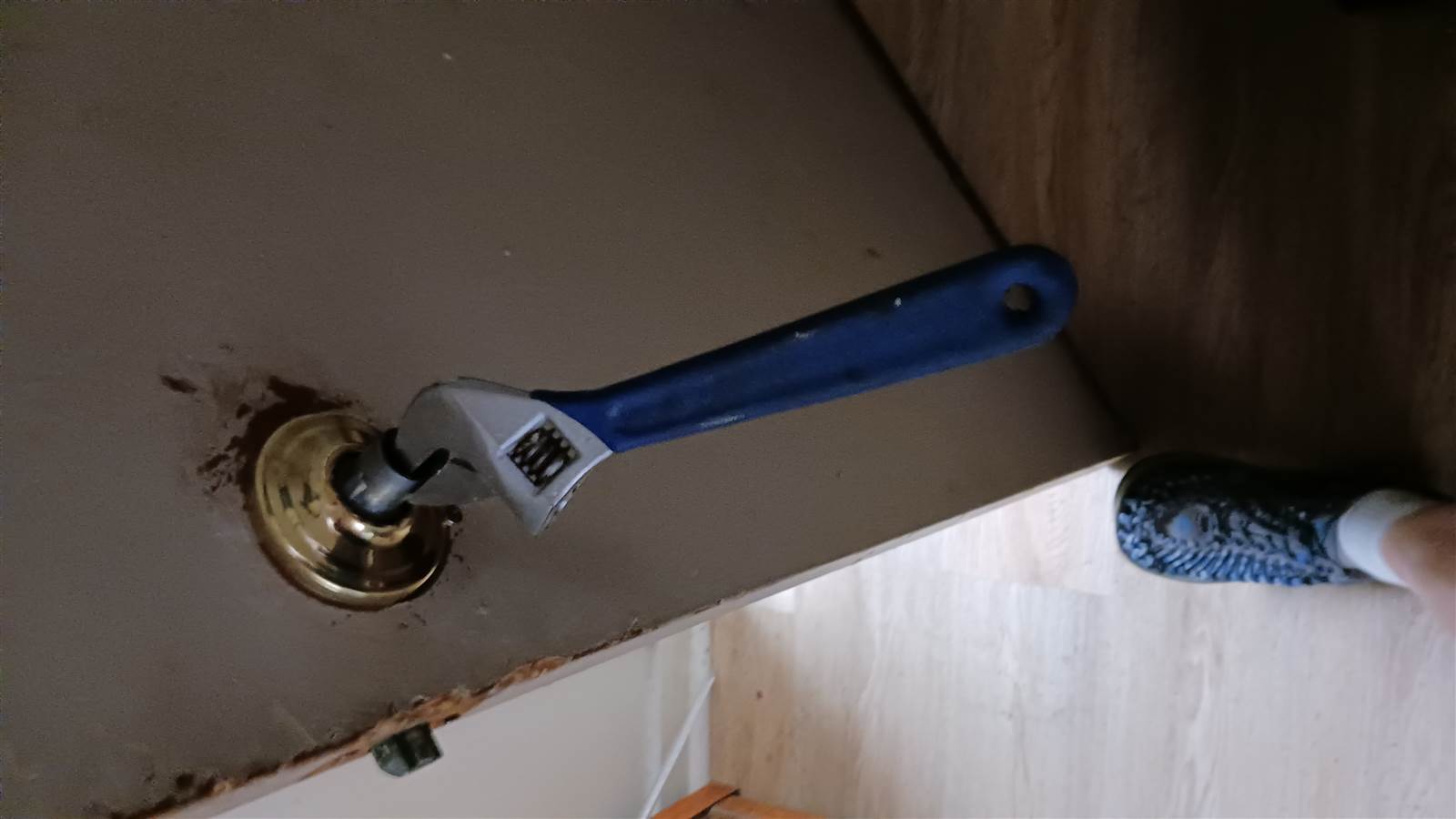 Resident holding a detached doorknob